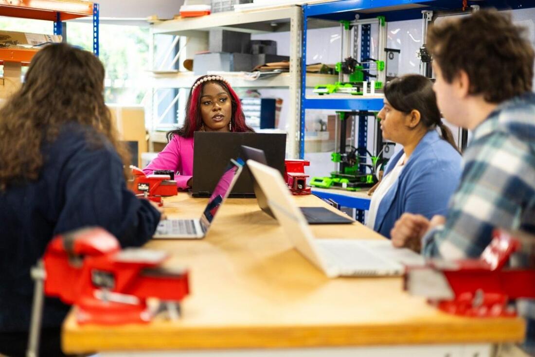 Four students with laptops